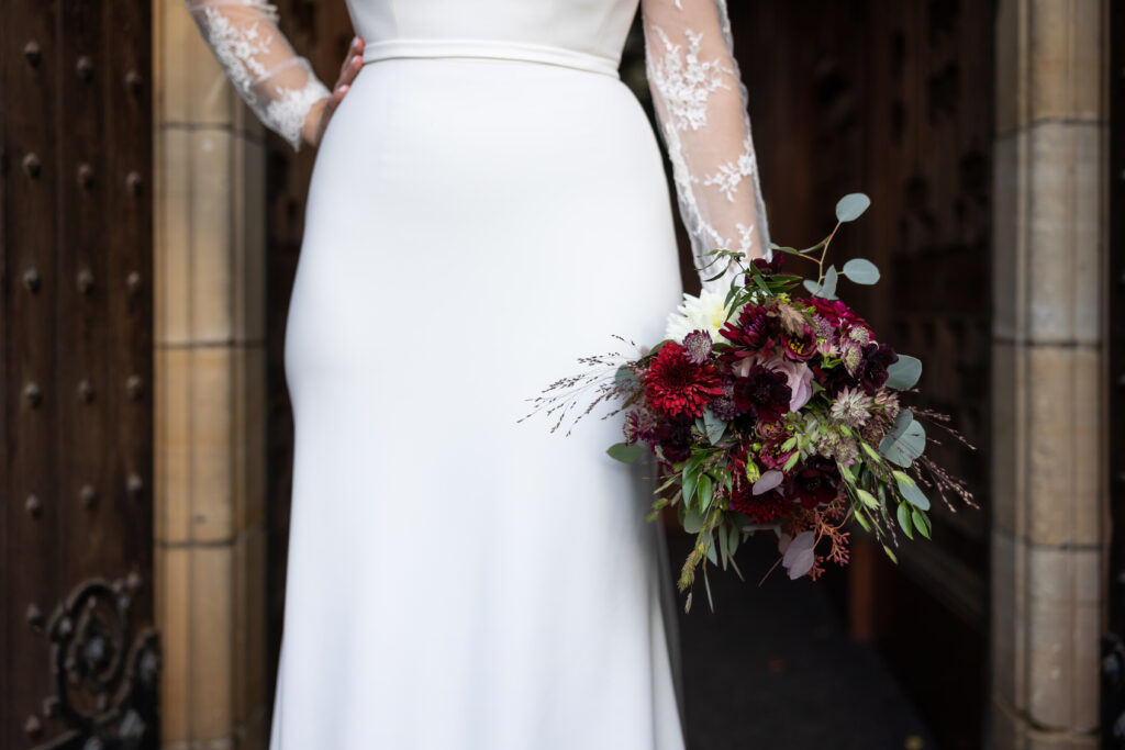 bride in white dress with autumnal bouquet - autumn wedding