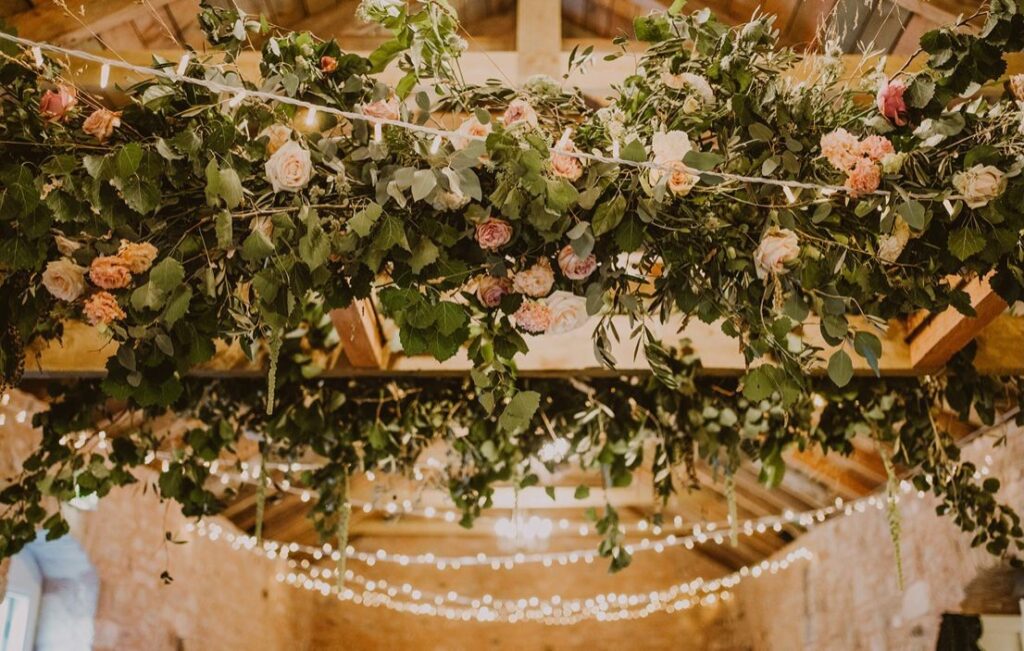 ceiling flower installation wedding